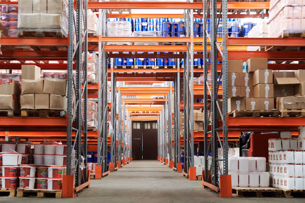 High-bay warehouse racking filled with palletised goods
